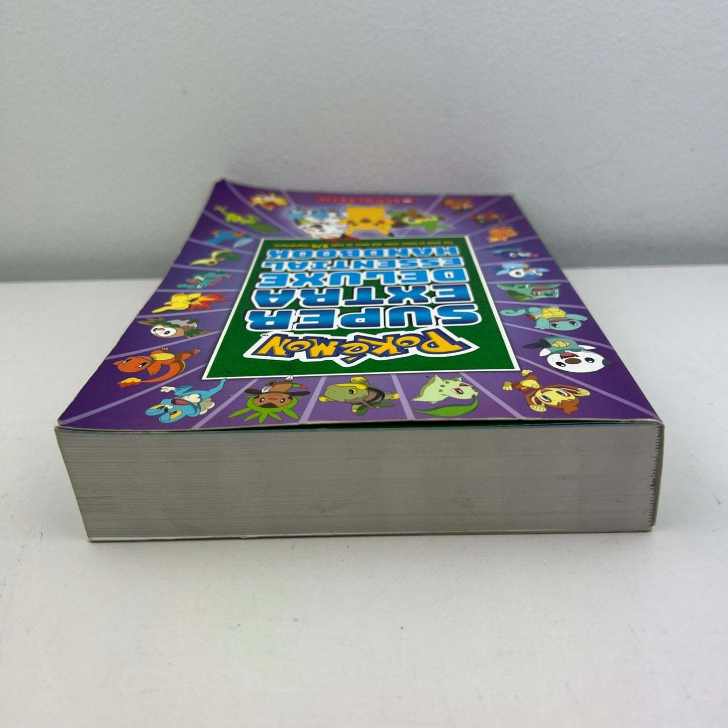 Pokémon Super Extra Deluxe Essential Handbook Paperback Book